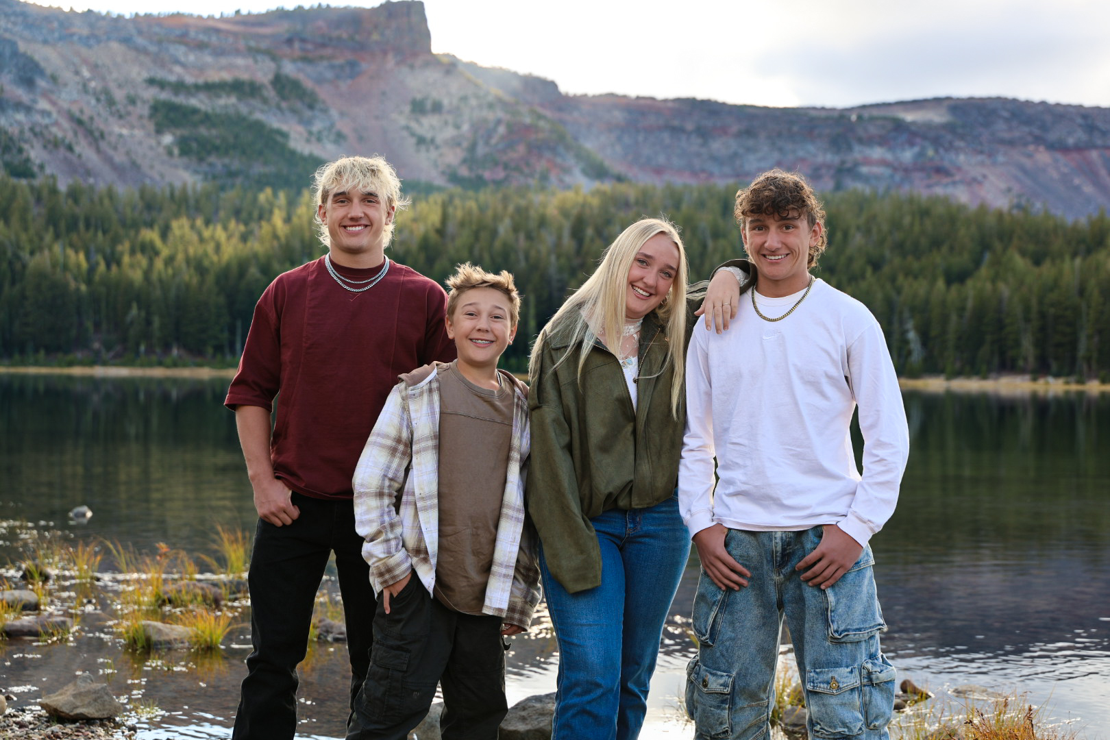 Dr. Kemp’s children standing together at a mountain lake in Central Oregon